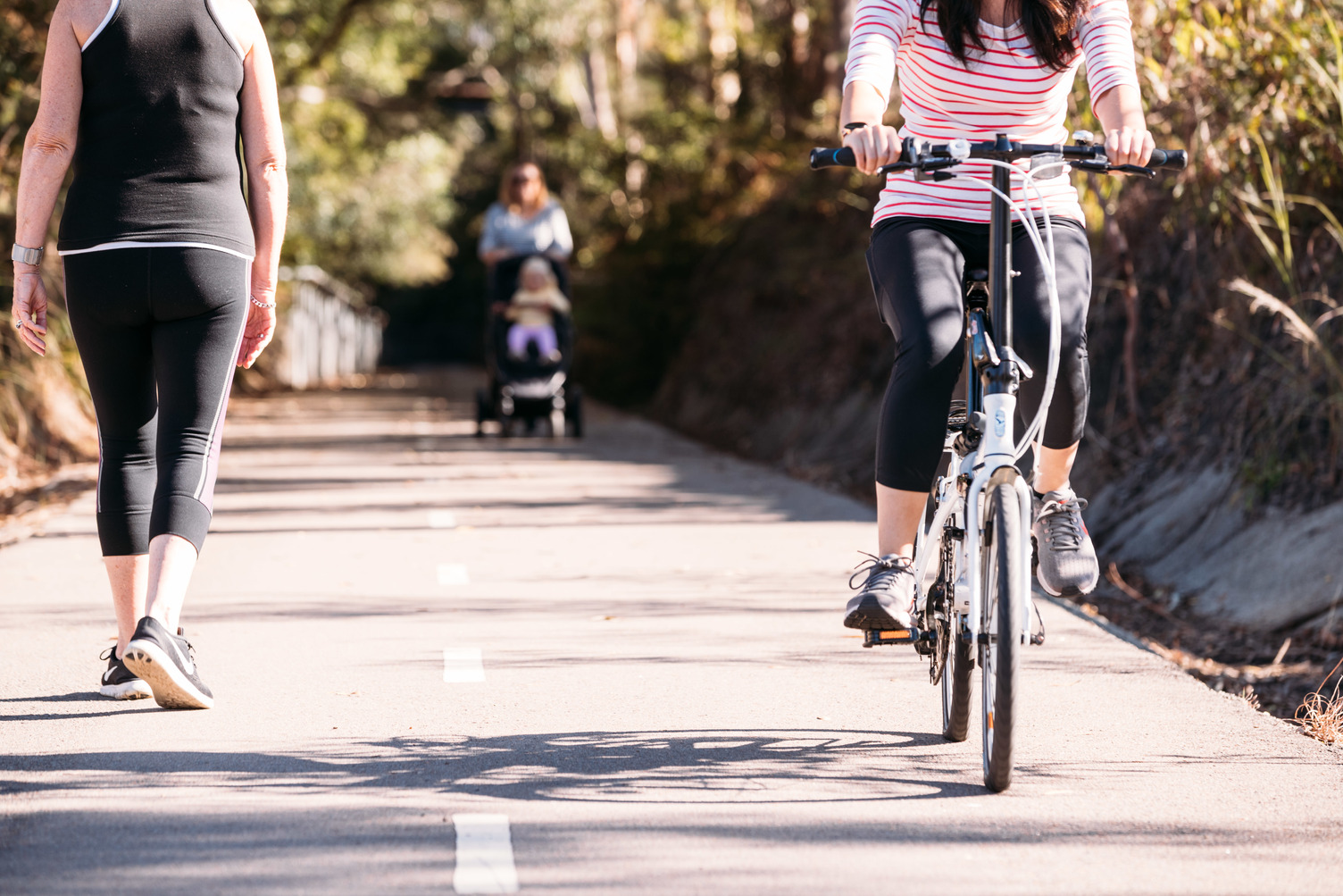 people cycling on a bicycle track with - Feature Image Original